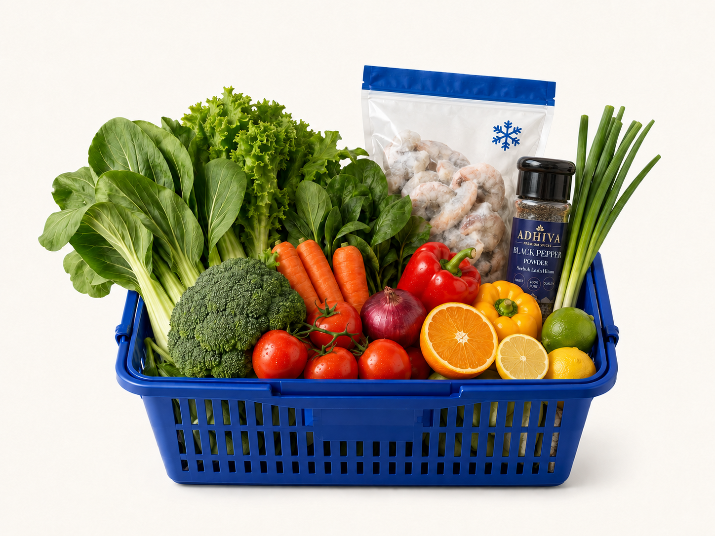 Blue basket filled with fresh vegetables, fruits, frozen food and a real ADHIVA Black Pepper bottle